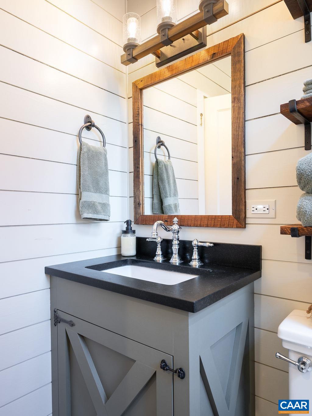 631 Old Rectory Lane Fork Union, VA 23055 - Photo 27 of 65 a bathroom with a sink and a mirror