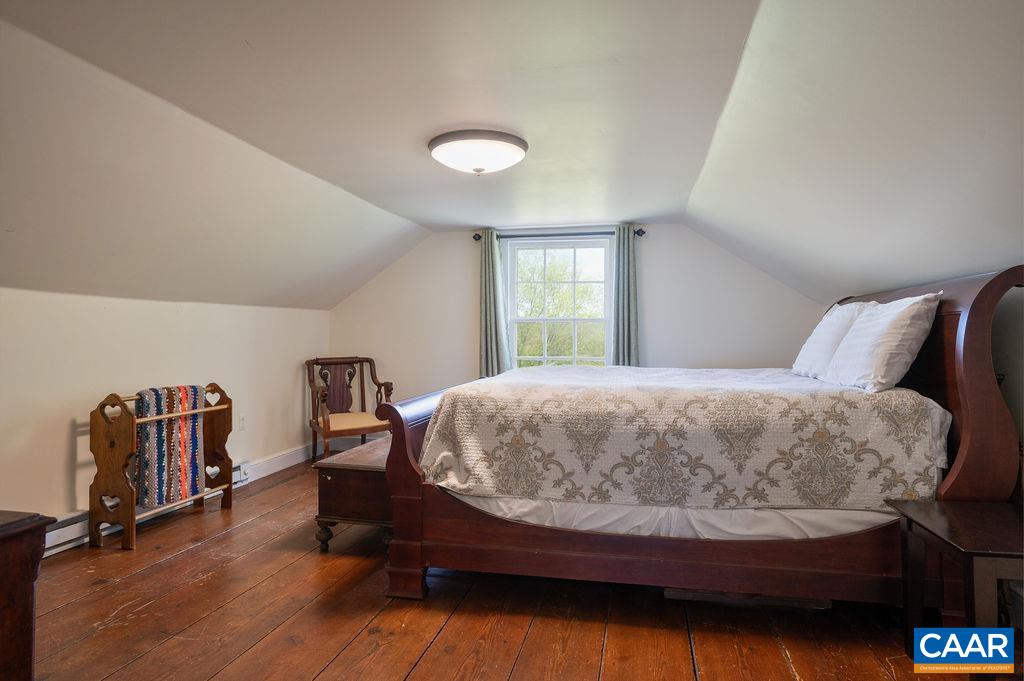631 Old Rectory Lane Fork Union, VA 23055 - Photo 31 of 65 a bedroom with a bed and wooden floor