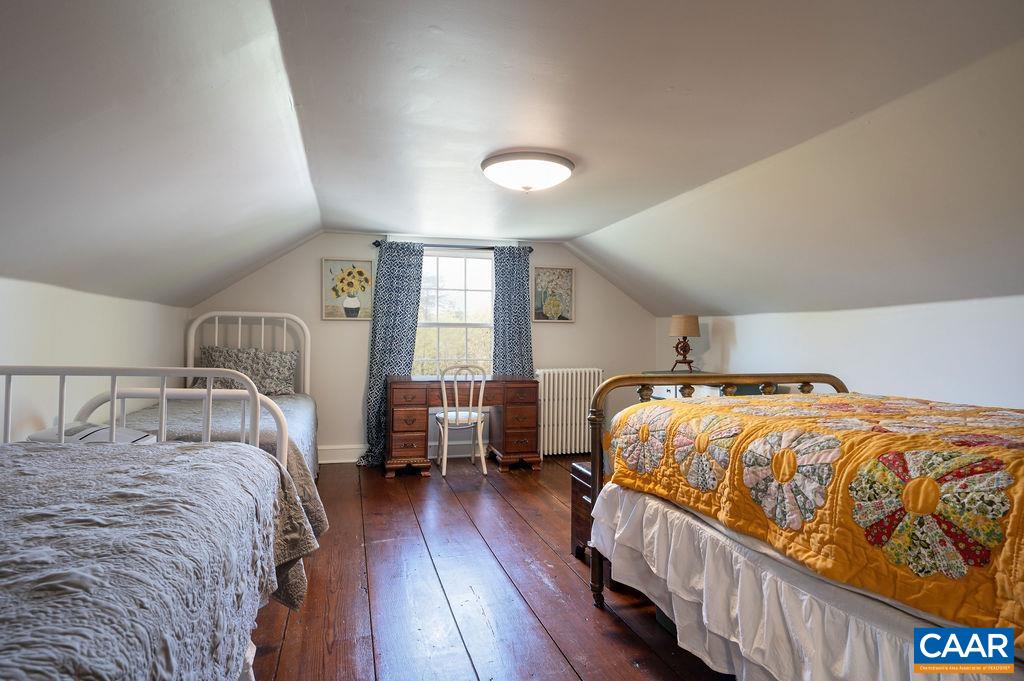 631 Old Rectory Lane Fork Union, VA 23055 - Photo 32 of 65 a bedroom with a bed and wooden floor