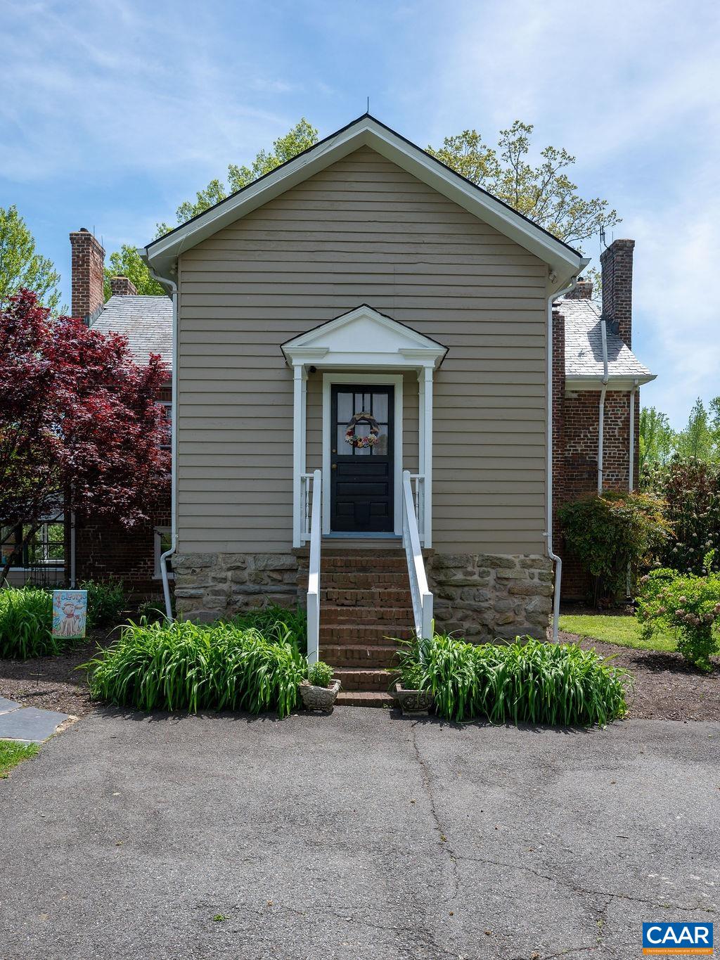 631 Old Rectory Lane Fork Union, VA 23055 - Photo 36 of 65 a front view of a house with garage