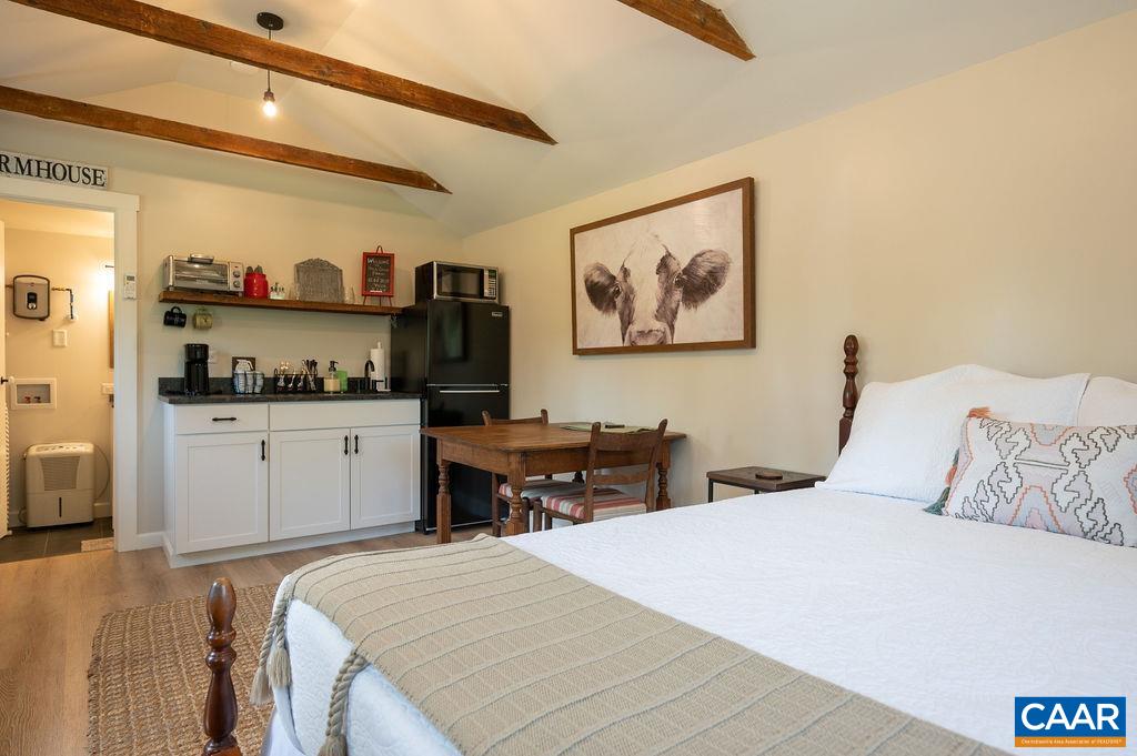 631 Old Rectory Lane Fork Union, VA 23055 - Photo 38 of 65 a bedroom with a bed and a refrigerator