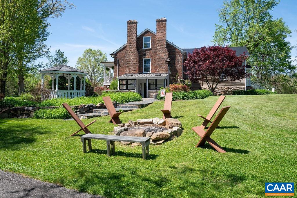 631 Old Rectory Lane Fork Union, VA 23055 - Photo 45 of 65 a view of a chair and table in backyard of the house