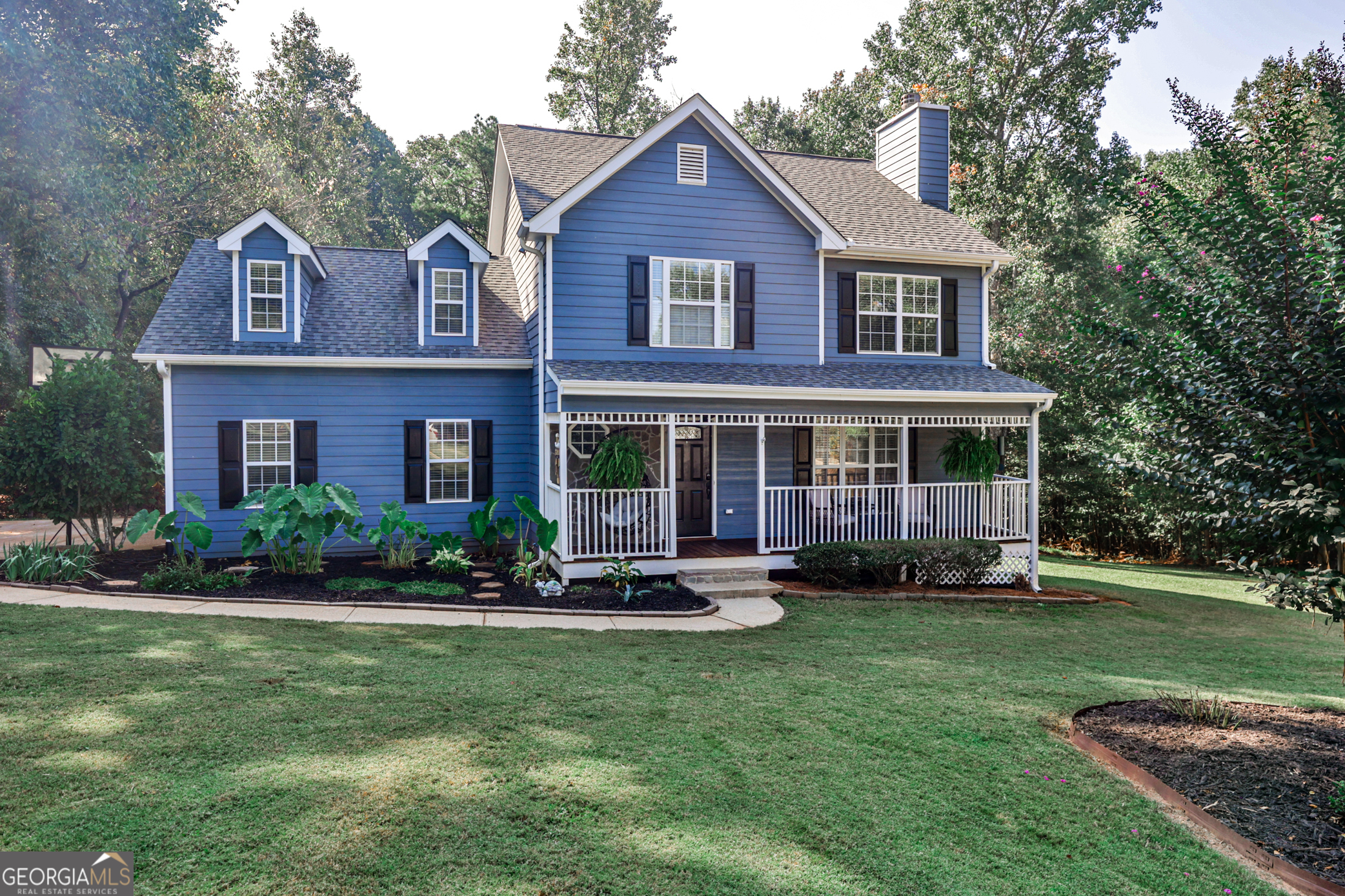 68 Soaring Lane Jefferson, GA 30549 - Photo 1 of 1 a front view of a house with a yard table and chairs