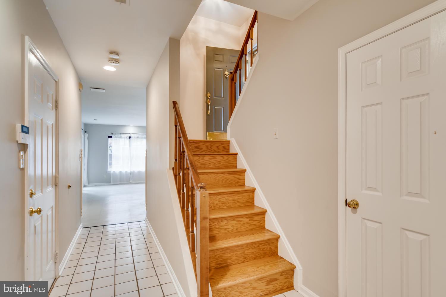 512 Kinsale Road Lutherville-Timonium, MD 21093 - Photo 27 of 37 Lower level hallway with stairs to main level