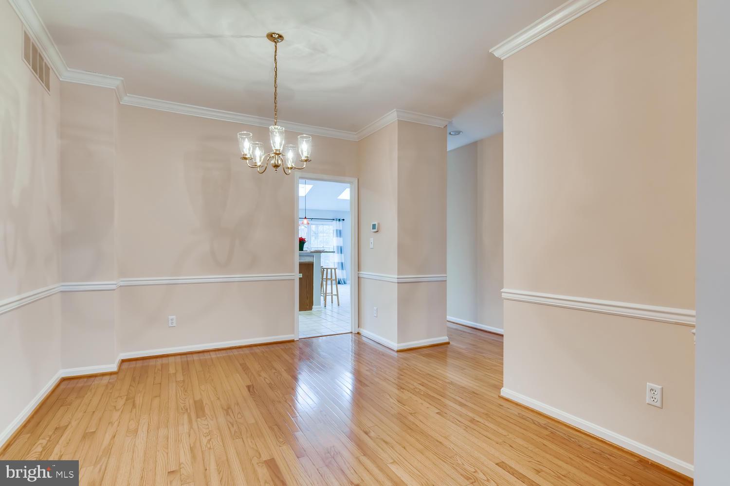 512 Kinsale Road Lutherville-Timonium, MD 21093 - Photo 4 of 37 Dining room with chair rail and crown molding