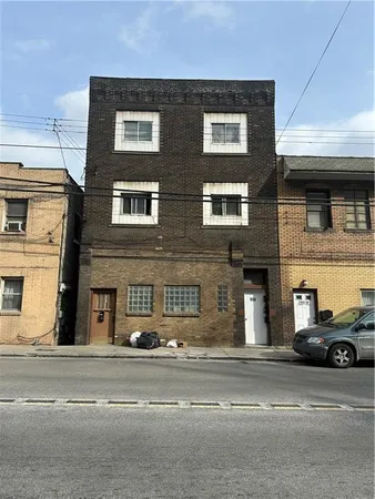 a view of a car parked on the side of a building
