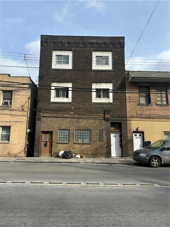 a view of a car parked on the side of a building