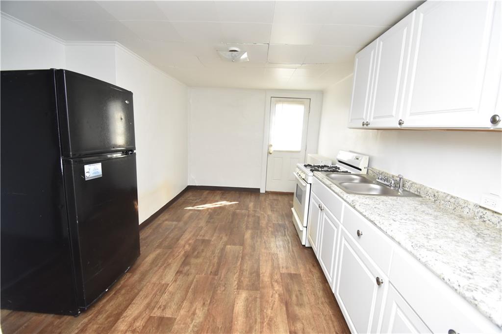 924 Island Avenue McKees Rocks, PA 15136 - Photo 11 of 29 a kitchen with granite countertop a refrigerator and a sink