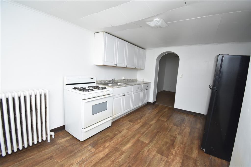 924 Island Avenue McKees Rocks, PA 15136 - Photo 13 of 29 a kitchen with stainless steel appliances a white cabinets and a sink
