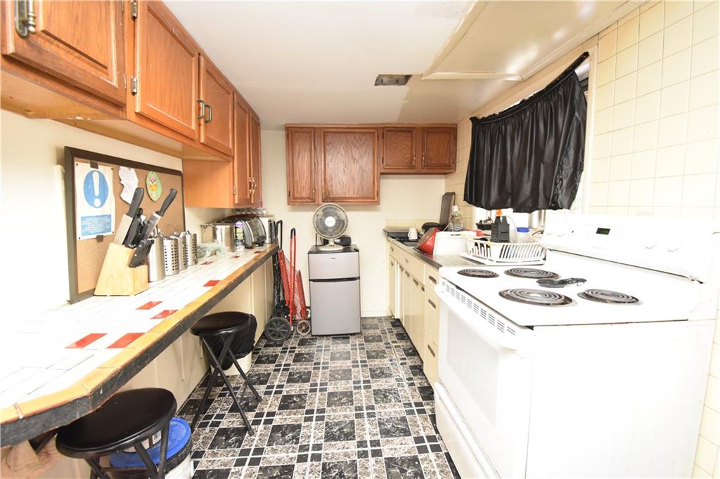 924 Island Avenue McKees Rocks, PA 15136 - Photo 18 of 29 a kitchen that has a sink and a stove in it