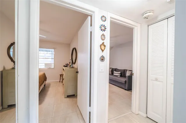 a bed room with a bed and a chandelier