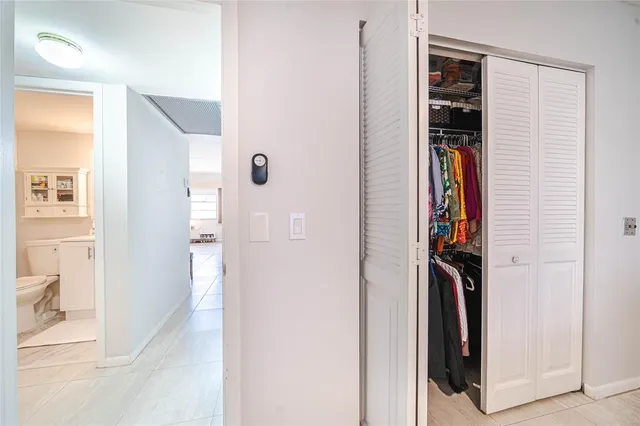 a bathroom with a toilet a sink and a mirror