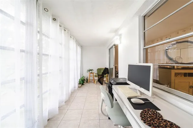 a bed room with a bed and a large window