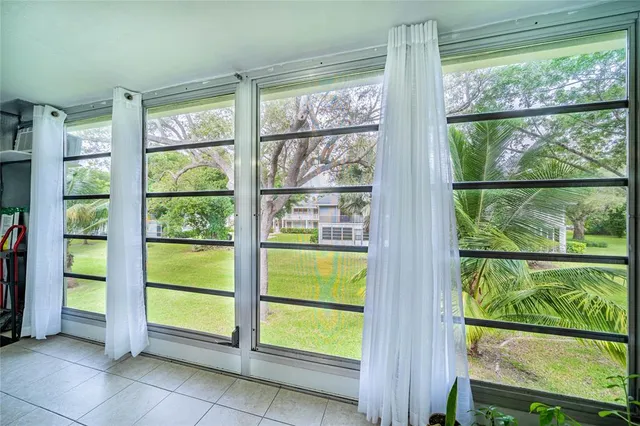 a view of a hallway with stairs