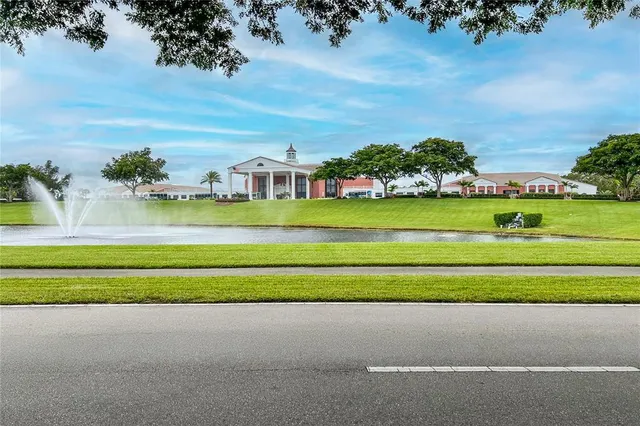 a swimming pool with outdoor seating and outdoor seating