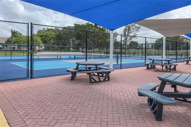 a room with gym equipment and windows