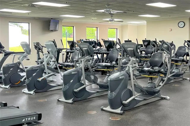 a view of swimming pool with outdoor seating and plants