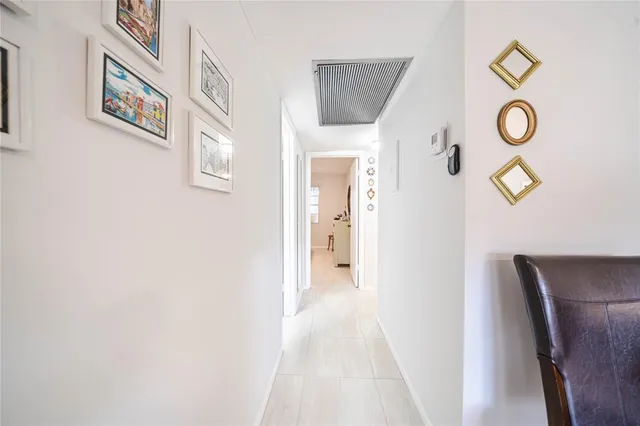 a bathroom with a glass door shower