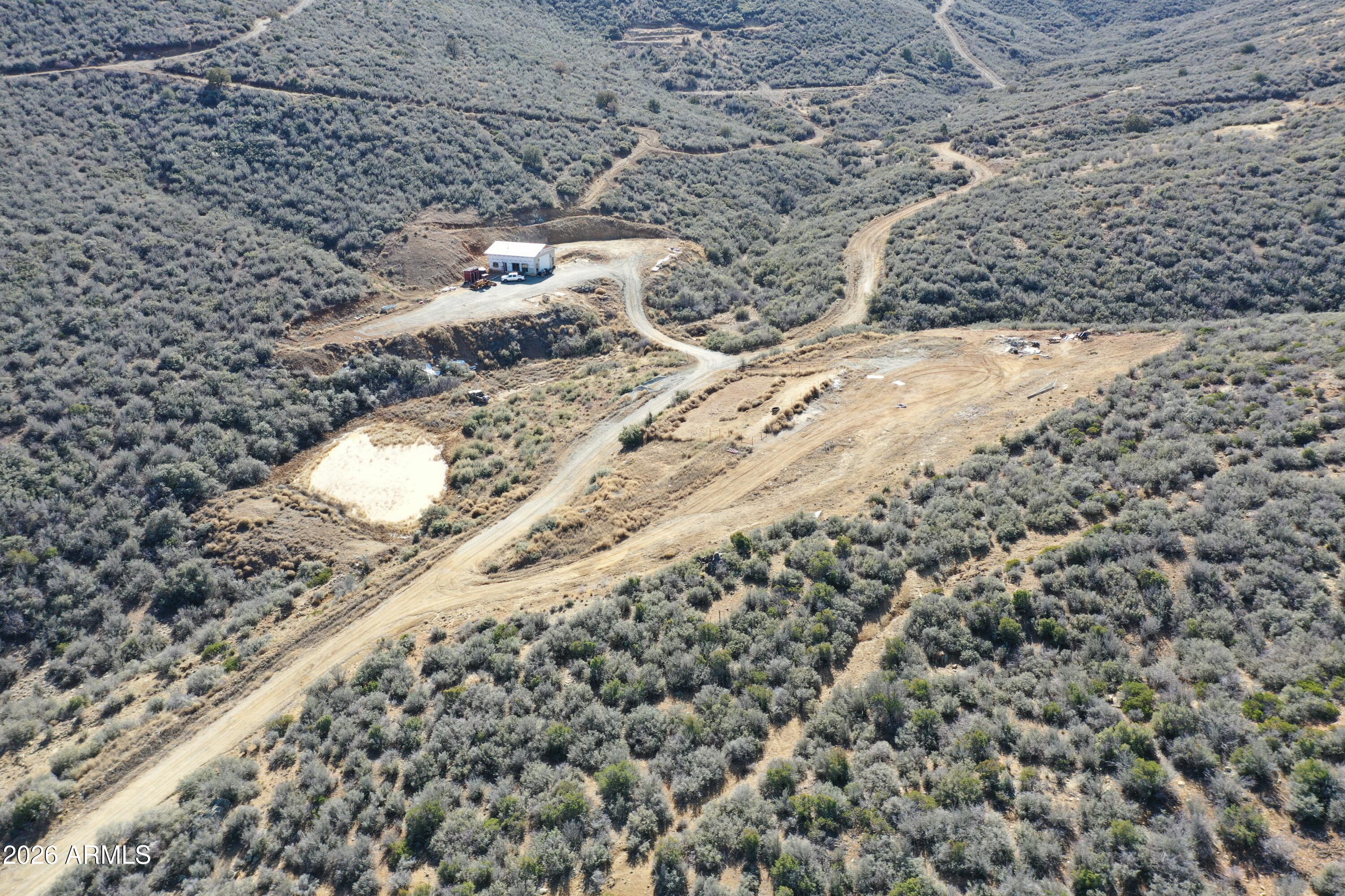 20 Miners Pick Road, Unit 20 Mayer, AZ 86333 - Photo 36 of 64 a view of a road with a yard