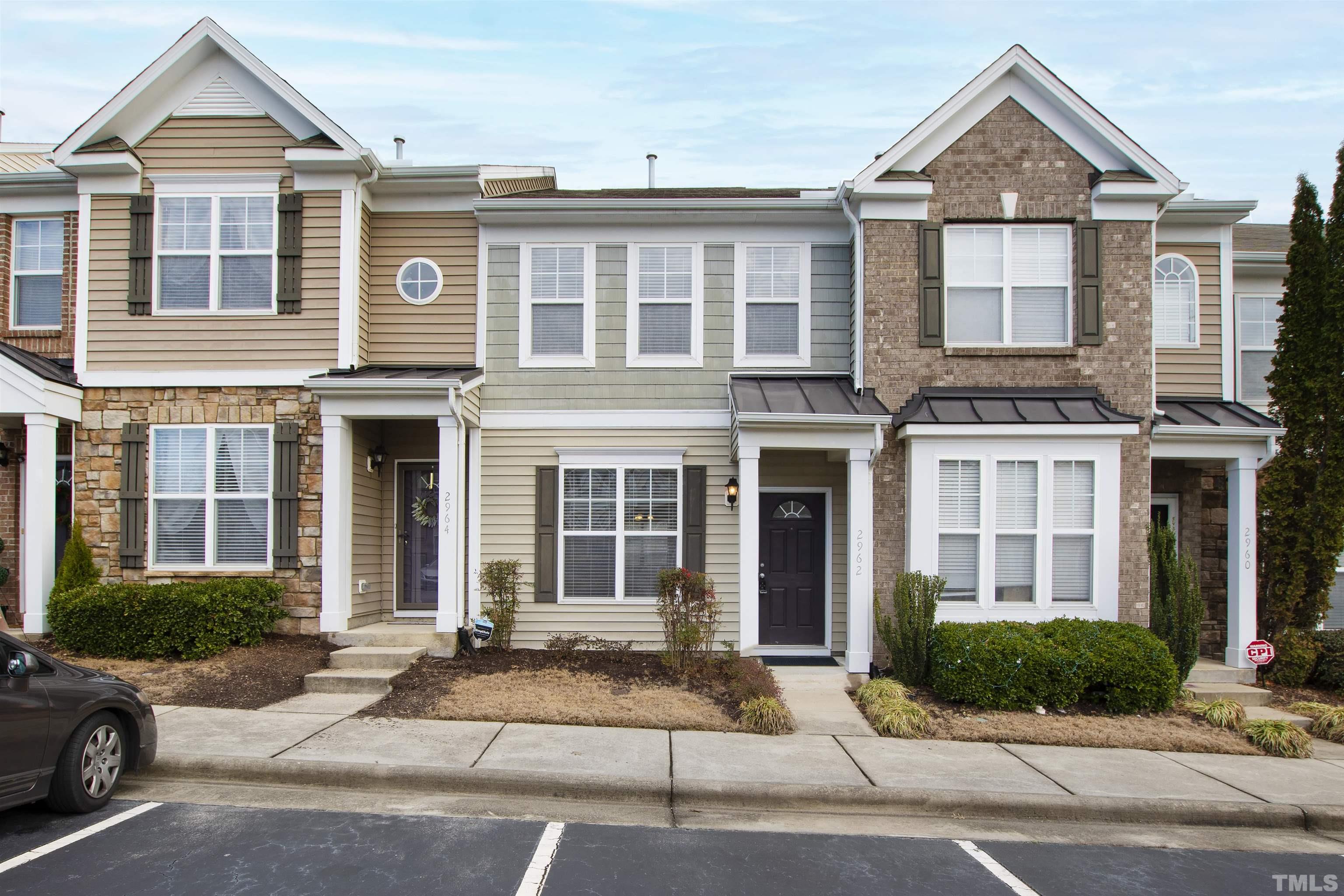 2962 Casona Way Raleigh, NC 27616 - Photo 1 of 40 a view of a brick house with a yard and large windows