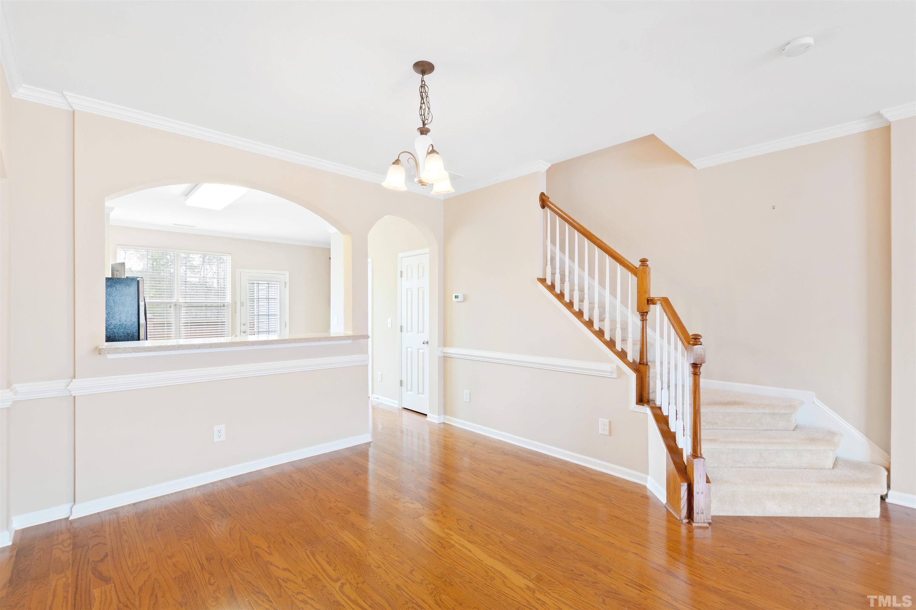 2962 Casona Way Raleigh, NC 27616 - Photo 12 of 40 a view of empty room with wooden floor and fan