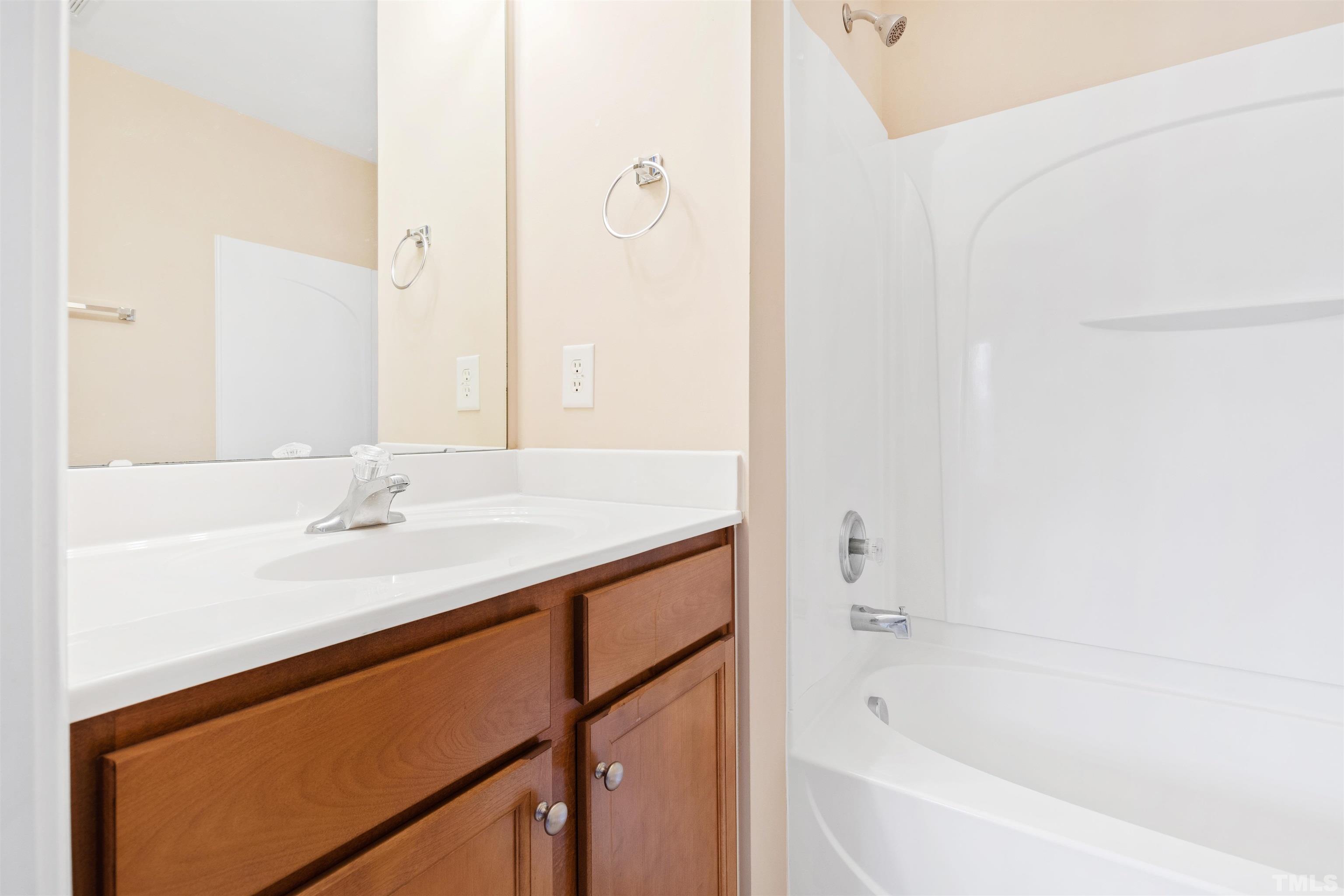 2962 Casona Way Raleigh, NC 27616 - Photo 30 of 40 a bathroom with a bathtub and a sink
