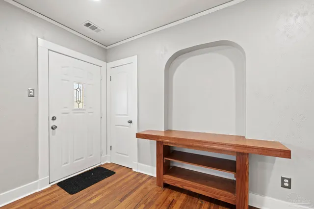 a view of room with wooden floor and closet