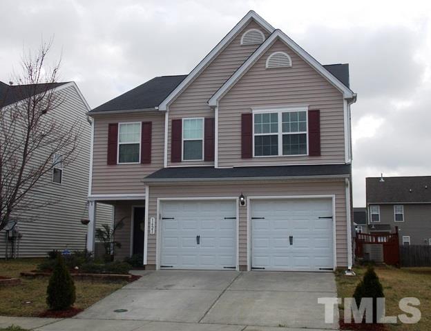 1621 Extine Lane Raleigh, NC 27610 - Photo 1 of 25 a front view of a house with garage