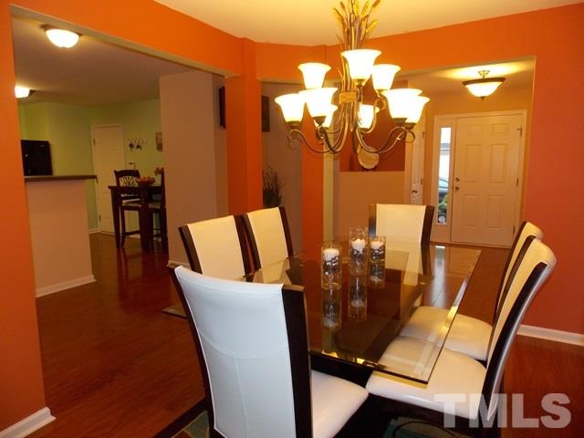 1621 Extine Lane Raleigh, NC 27610 - Photo 2 of 25 a view of a dining room with furniture and wooden floor
