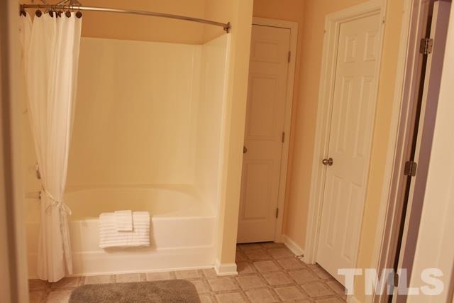 1621 Extine Lane Raleigh, NC 27610 - Photo 13 of 25 a bathroom with a shower