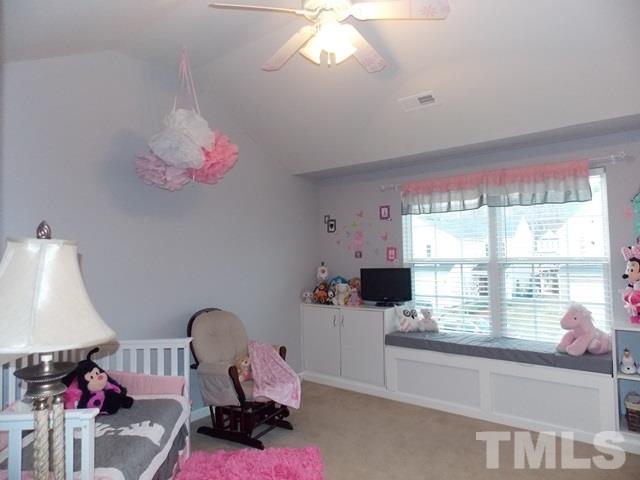1621 Extine Lane Raleigh, NC 27610 - Photo 14 of 25 a living room with furniture and a flat screen tv