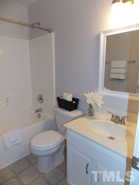 1621 Extine Lane Raleigh, NC 27610 - Photo 16 of 25 a bathroom with a sink a toilet and shower