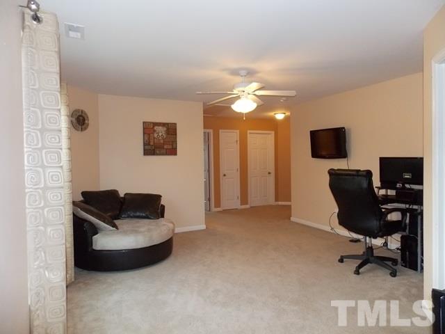1621 Extine Lane Raleigh, NC 27610 - Photo 17 of 25 a living room with furniture and a piano