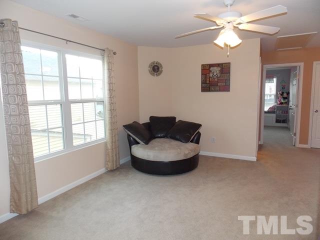 1621 Extine Lane Raleigh, NC 27610 - Photo 18 of 25 a living room with furniture and a large window