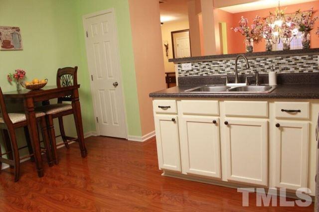 1621 Extine Lane Raleigh, NC 27610 - Photo 19 of 25 a bathroom with a sink and a mirror