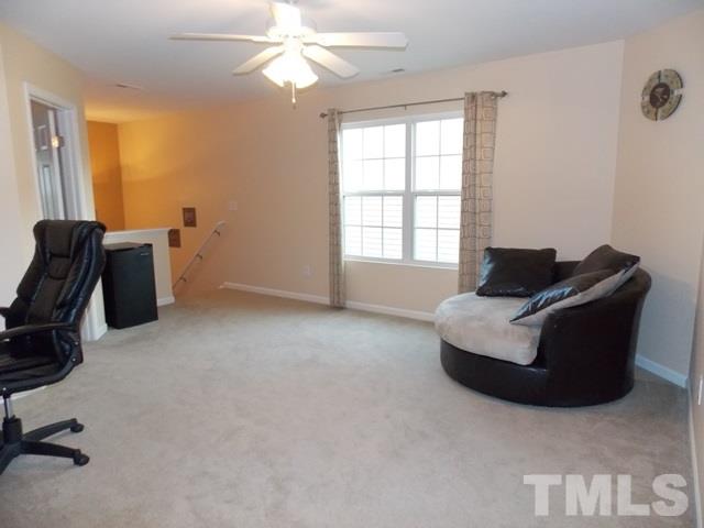 1621 Extine Lane Raleigh, NC 27610 - Photo 21 of 25 a living room with furniture and a window