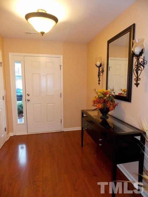 1621 Extine Lane Raleigh, NC 27610 - Photo 22 of 25 a view of a workspace room with wooden floor cabinet and mirror