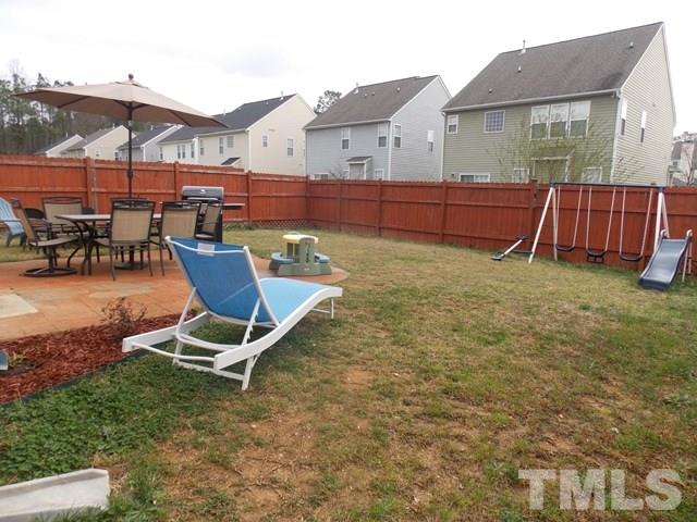 1621 Extine Lane Raleigh, NC 27610 - Photo 25 of 25 a view of a house with backyard porch and sitting area