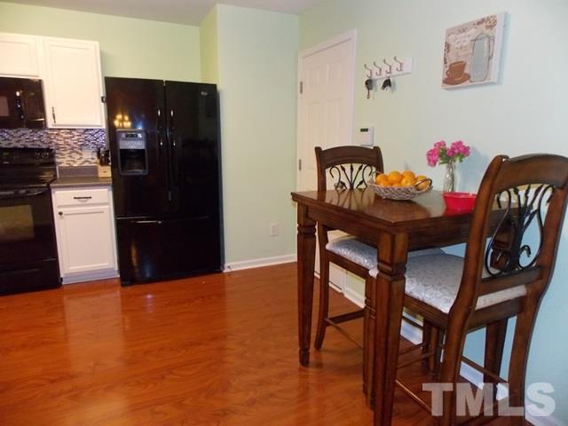 1621 Extine Lane Raleigh, NC 27610 - Photo 10 of 25 a view of a dining room with furniture