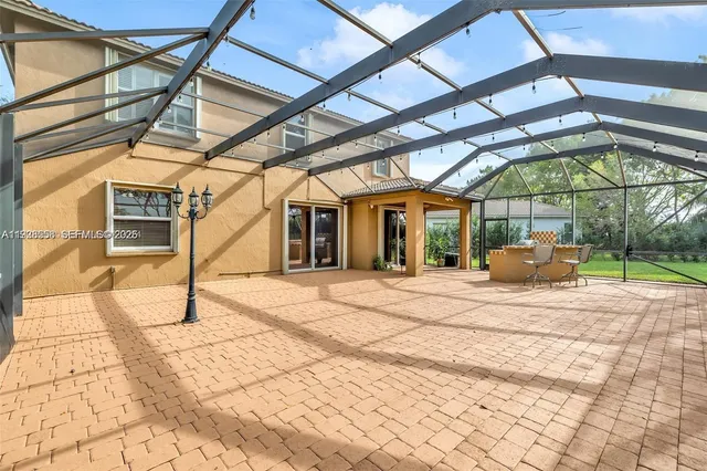 a view of a backyard with a large tree