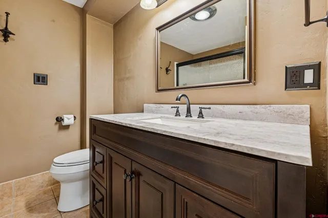 an empty room with a ceiling fan