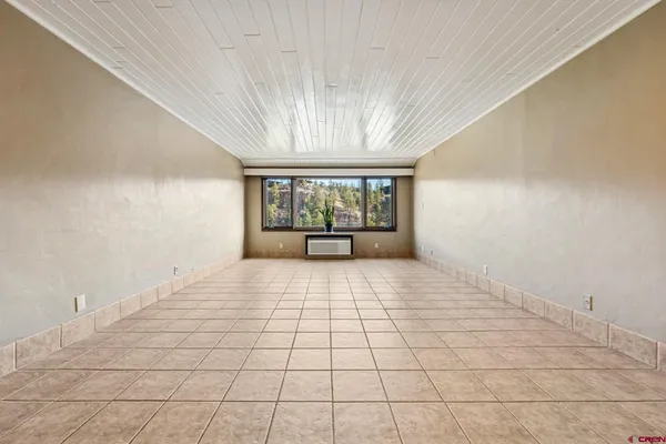 a view of an empty room with a window