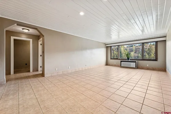 a view of an empty room with a window