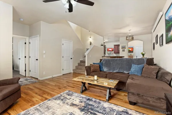 a living room with furniture and a rug