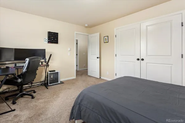 a bedroom with a workspace