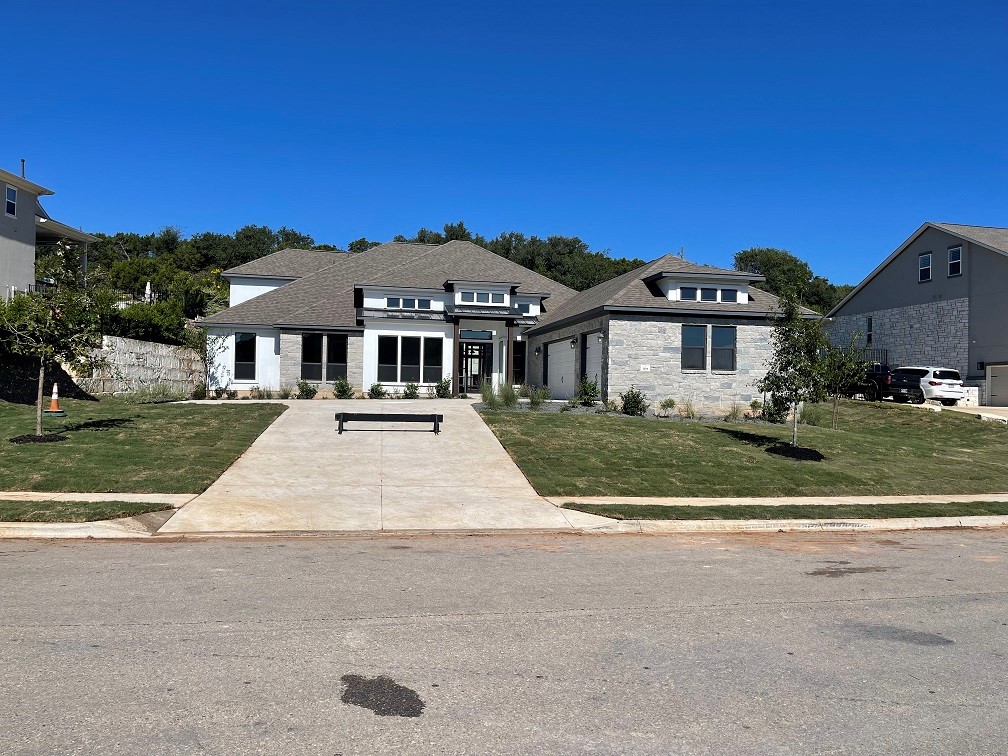 front view of a house with a yard