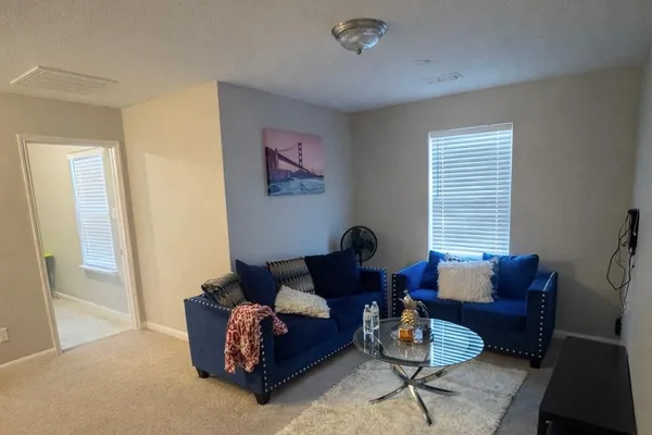 a living room with furniture and a window