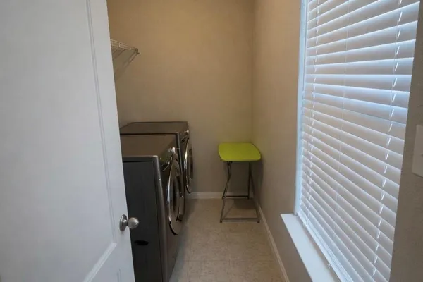 a view of a room with a washer and dryer