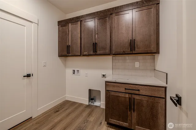 a kitchen with a sink and a microwave
