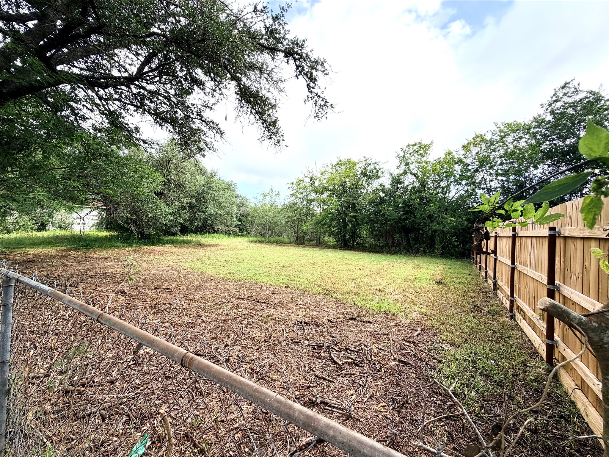702 East 18th Street Cameron, TX 76520 - Photo 5 of 14 Securely fenced and private, this lot provides an ideal setting for your next build.